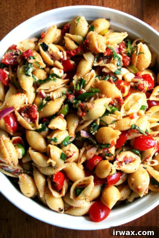 This simple pasta salad is particularly good warm, when the just-boiled shells melt the cheese, just slightly cook the tomatoes and soak up all the flavors of the olive oil and lemon juice. It can also be prepared ahead and served at room temperature — it tastes better the longer it sits in fact. // alexandracooks.com This simple pasta salad is particularly good warm, when the just-boiled shells melt the cheese, just slightly cook the tomatoes and soak up all the flavors of the olive oil and lemon juice. It can also be prepared ahead and served at room temperature — it tastes better the longer it sits in fact. // alexandracooks.com