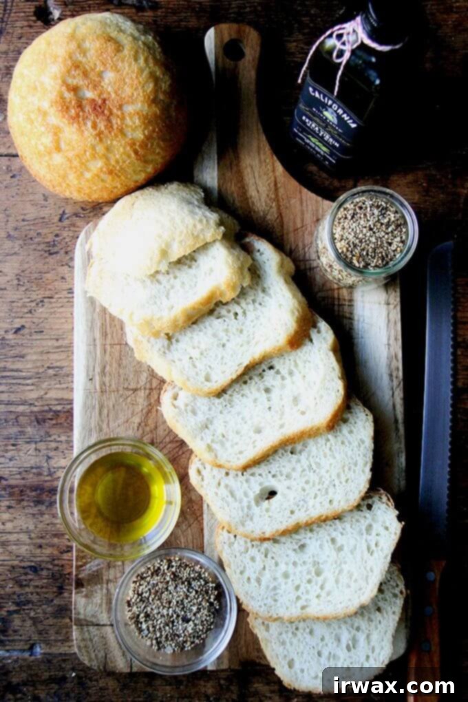 Fresh bread, good olive oil, a smoky, seedy dukkah—this appetizer reminded me how a simple flourish can make such an impression—it can be, in fact, all everyone needs to kick off an evening; it can be everything everyone dreams about for days. // alexandracooks.com Ένα ξύλο κοπής με φρέσκο σπιτικό ψωμί και σπιτική ντούκα χωρίς ξηρούς καρπούς.