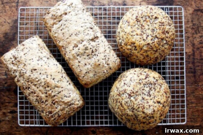 Φρυγανιστό Ψωμί Κινόας και Λιναρόσπορου 17 just-baked quinoa-flax pullman loaves and dinner loaves cooling on cooling rack.
