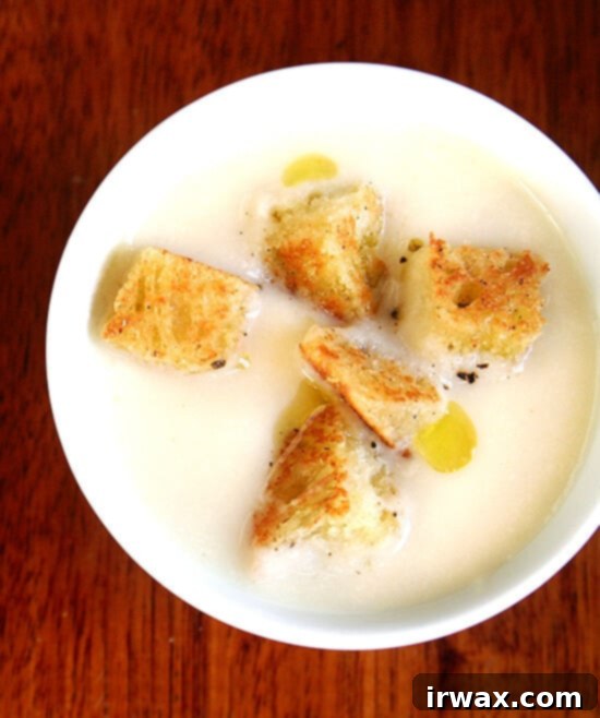 This recipe for cauliflower and apple puree soup calls for simmering cauliflower in milk with an apple and a few strands of pasta, the milk and apple included to temper the cauliflower's intensity, the pasta to provide just enough starch to ensure a creamy texture when the mixture is puréed. Both the purée and the soup are silky smooth in texture, and for containing just a few teaspoons of butter, taste incredibly creamy. // alexandracooks.com This recipe for cauliflower and apple puree soup calls for simmering cauliflower in milk with an apple and a few strands of pasta, the milk and apple included to temper the cauliflower's intensity, the pasta to provide just enough starch to ensure a creamy texture when the mixture is puréed. Both the purée and the soup are silky smooth in texture, and for containing just a few teaspoons of butter, taste incredibly creamy. // alexandracooks.com